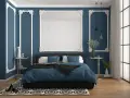 Chambre élégante avec murs bleu nuit et moulures blanches. Le lit est paré de linge de lit bleu roi, créant 2 couleurs qui vont bien ensemble pour une chambre.