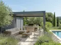 Un élégant pool house provençal avec salon extérieur, cuisine d'été et piscine, entouré d'oliviers et de lavande.