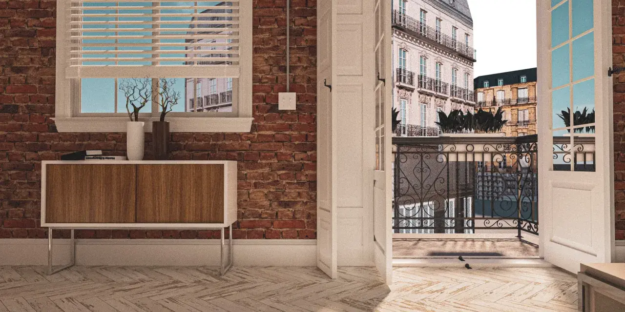 Vue d'un appartement avec une porte ouverte sur une terrasse parisienne. La différence entre balcon et terrasse est claire : ici, c'est un espace de vie extérieur spacieux.