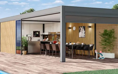 Un pool house moderne avec cuisine d'été, parfait pour des repas en plein air.