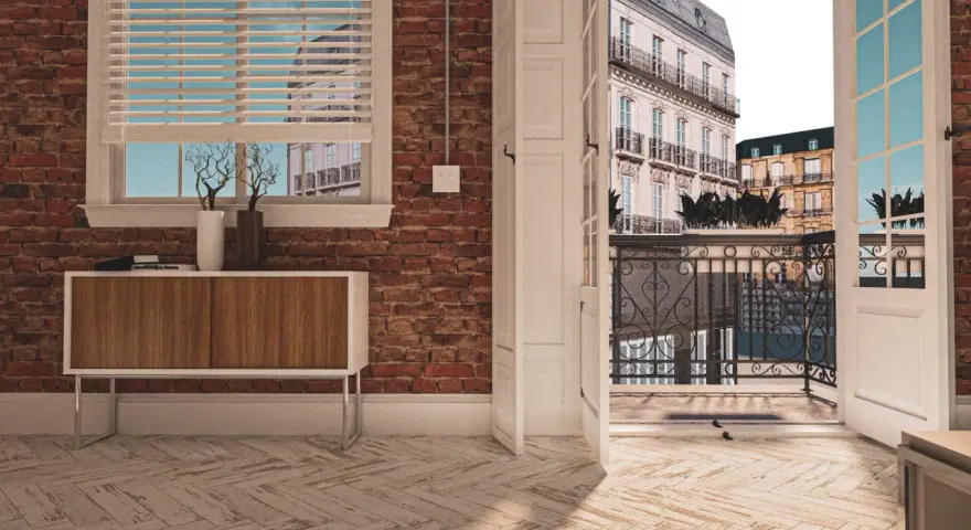 Vue d'un appartement avec une porte ouverte sur une terrasse parisienne. La différence entre balcon et terrasse est claire : ici, c'est un espace de vie extérieur spacieux.