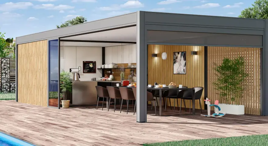 Un pool house moderne avec cuisine d'été, parfait pour des repas en plein air.